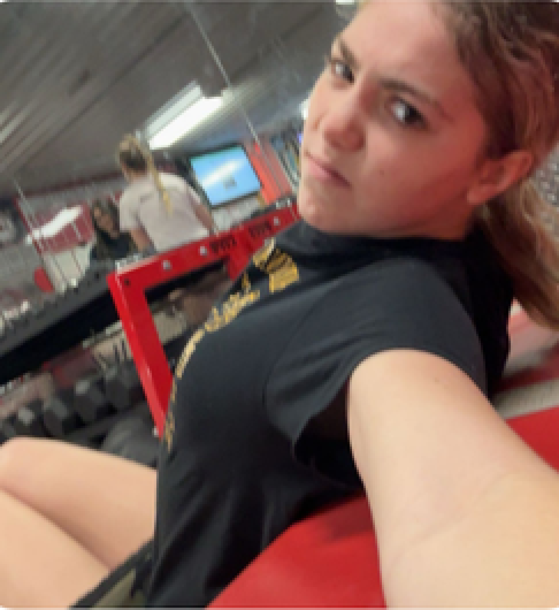 Cardinal student Macy Grove takes selfie in weight room.